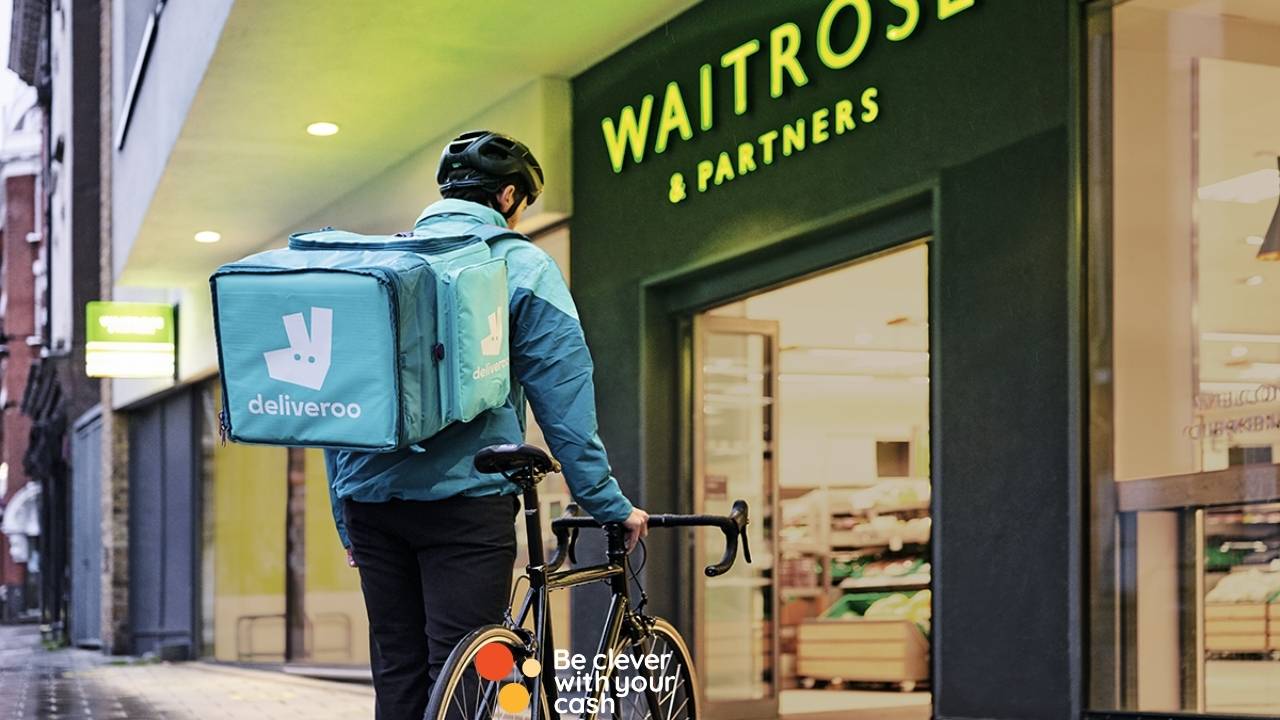 Photo of a deliveroo cyclist outside Waitrose